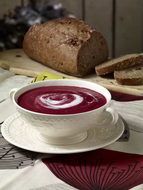 Beetroot soup with a swirl of coconut milk