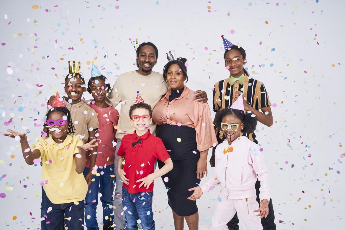 Omari Mcqueen with family and confetti