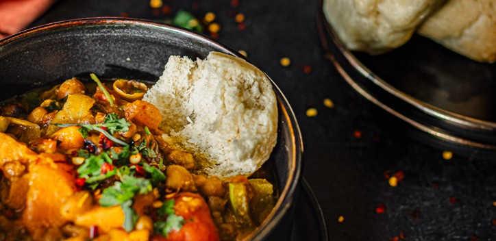 Bambara Bean and cowpea stew served with Dombolo (South African steam bread)  | The Vegan Society