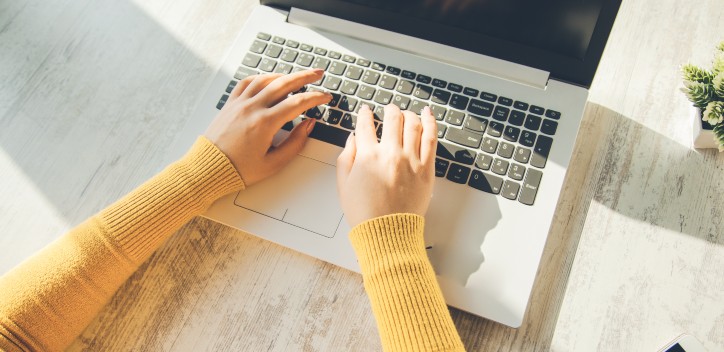 Person typing on computer