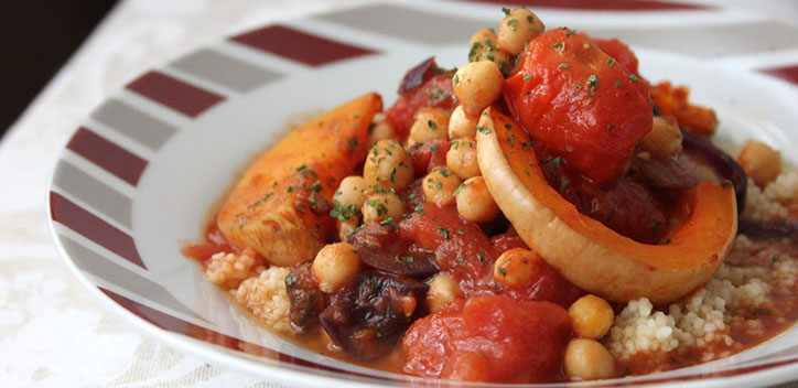 Chickpea butternut tagine served in a shallow decorative plate