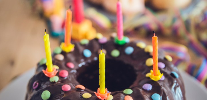 A vegan chocolate ring birthday cake servied on a plate.  Photo by Markus Spiske from Pexels