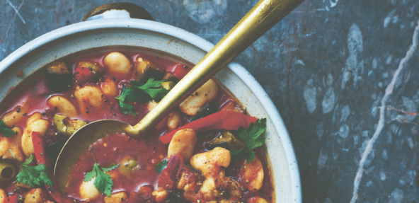 A bowl of aubergine, olive and butter bean stew.