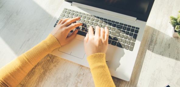 Person typing on computer
