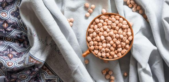 image of dried chickpeas in a bowl against a cloth