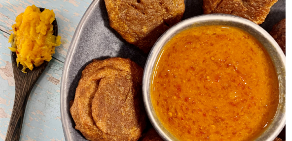 pumpkin fritters plated with sauce