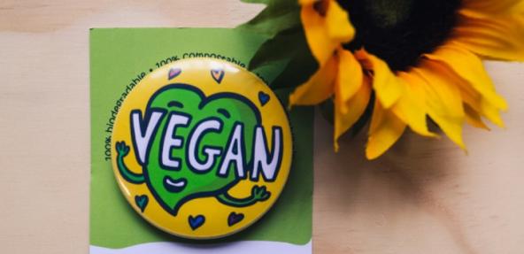 Vegan heart badge and sunflower