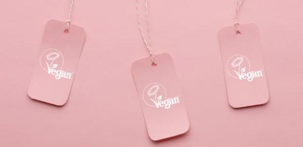 Labels with vegan written on them with pink background 