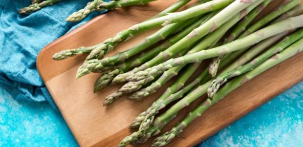 photo of asparagus on a chopping board