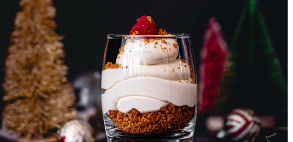 Vegan Baobab Cheesecake in a glass with festive background