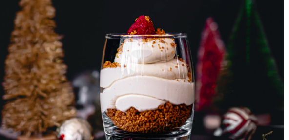 Vegan Baobab Cheesecake in a glass with festive background