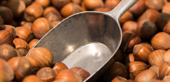 A close up of whole hazelnuts 