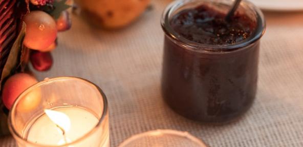 cranberry sauce on a table near candles
