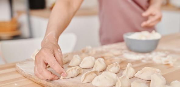 person preparing dumplings