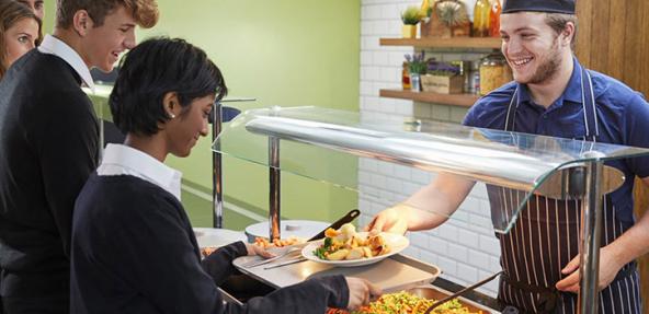 Photograph of students being served food