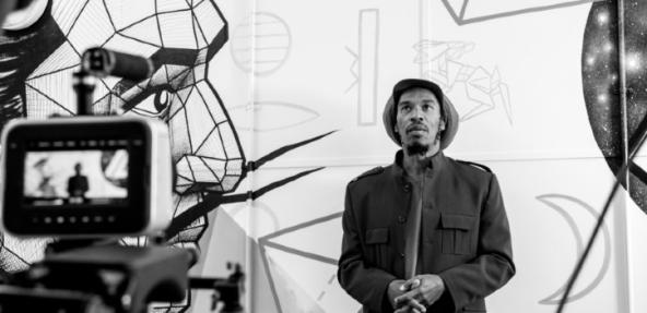 Black and white photograph of Benjamin Zephaniah in a studio