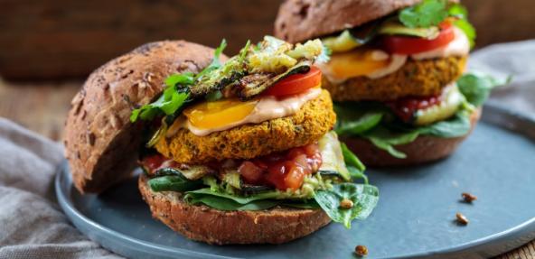 Butternut squash and chickpeas burger with tomato salsa, spinach, roast courgettes and avocado
