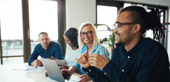 People smiling whilst working in an office