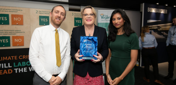 Winning the best exhibition stand award at the Labour Party Conference, presented by Eddie Izzard