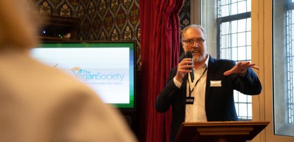 Photograph of Vegan Society CEO, Steve Hamon delivering a talk