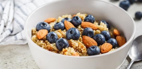 vegan healthy breakfast bowl with grains and blueberries