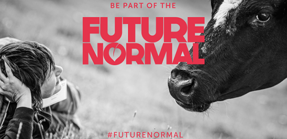 A black and white photo of a person looking at a cow with the Future Normal campaign logo over the top.