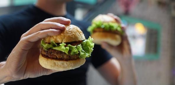 person holding a burger