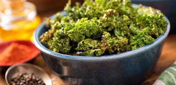 Bowl of kale crisps on a table