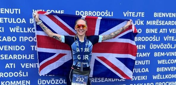 photo of Lisa Gawthrone holding up flag at European Duathlon Championship