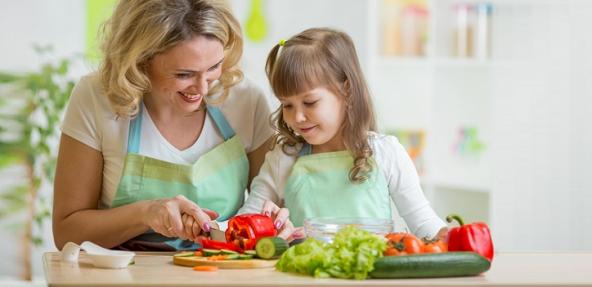 mother and daughter cooking