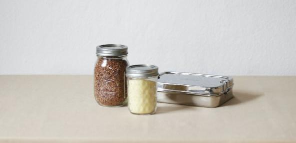 Food in glass jars and tin foil boxes