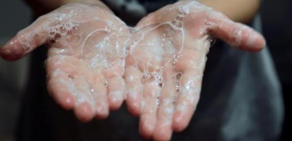 Hands with soap suds 