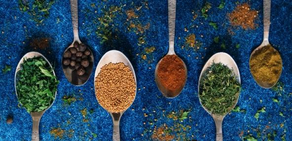 herbs and spices on spoons