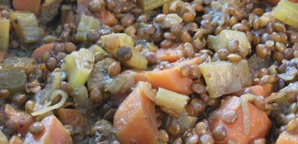 A close up of bean stew with lentils, carrots and onions.  Image by Bella RaKo from Pixabay.