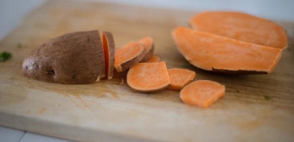chopped sweet potato on a chopping board