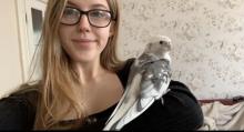 Vegan student Fiji with a bird on her shoulder