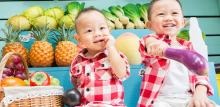 Children holding vegetables