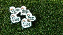 Five Life Members heart shaped badges on grass background