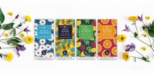 four oat milk vegan chocolate bars and flowers