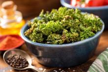 Bowl of kale crisps on a table