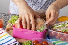 Person packing school lunches