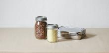 Food in glass jars and tin foil boxes