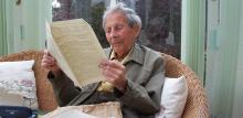 Donald Watson reading first issue of Vegan News