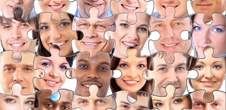 Faces of people joined together as a puzzle