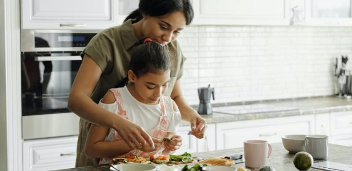 Mother and daughter meal prepping 