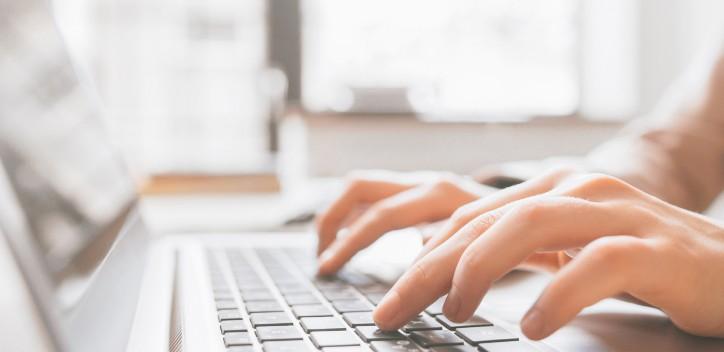 Person typing on laptop