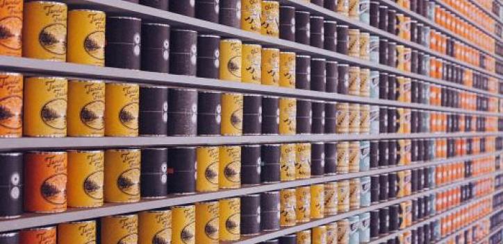 Canned food on supermarket shelves
