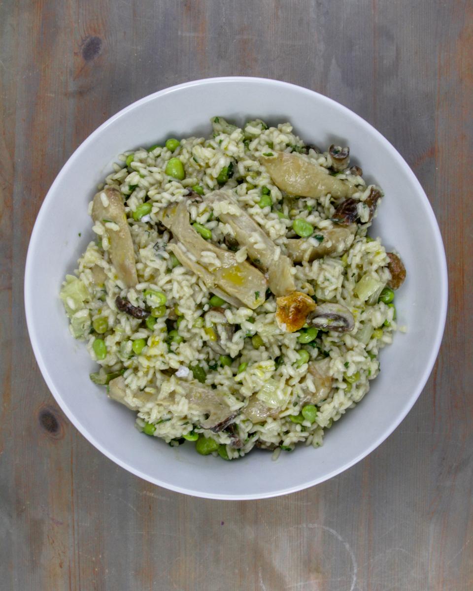 mushroom thyme and fennel risotto on a grey wooden background