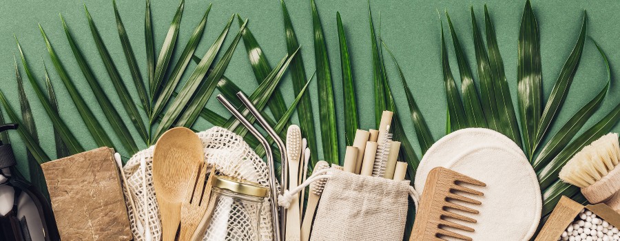 assorted eco goods on a background of leaves