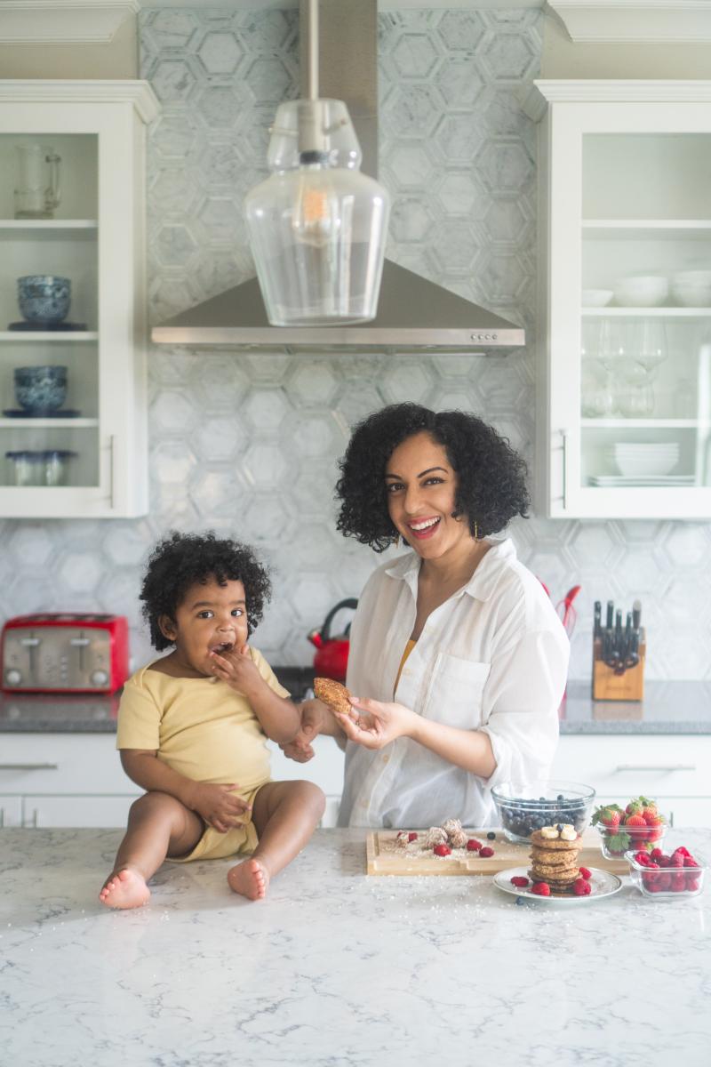 Ashley Renne Nsonwu and baby in the kitchen